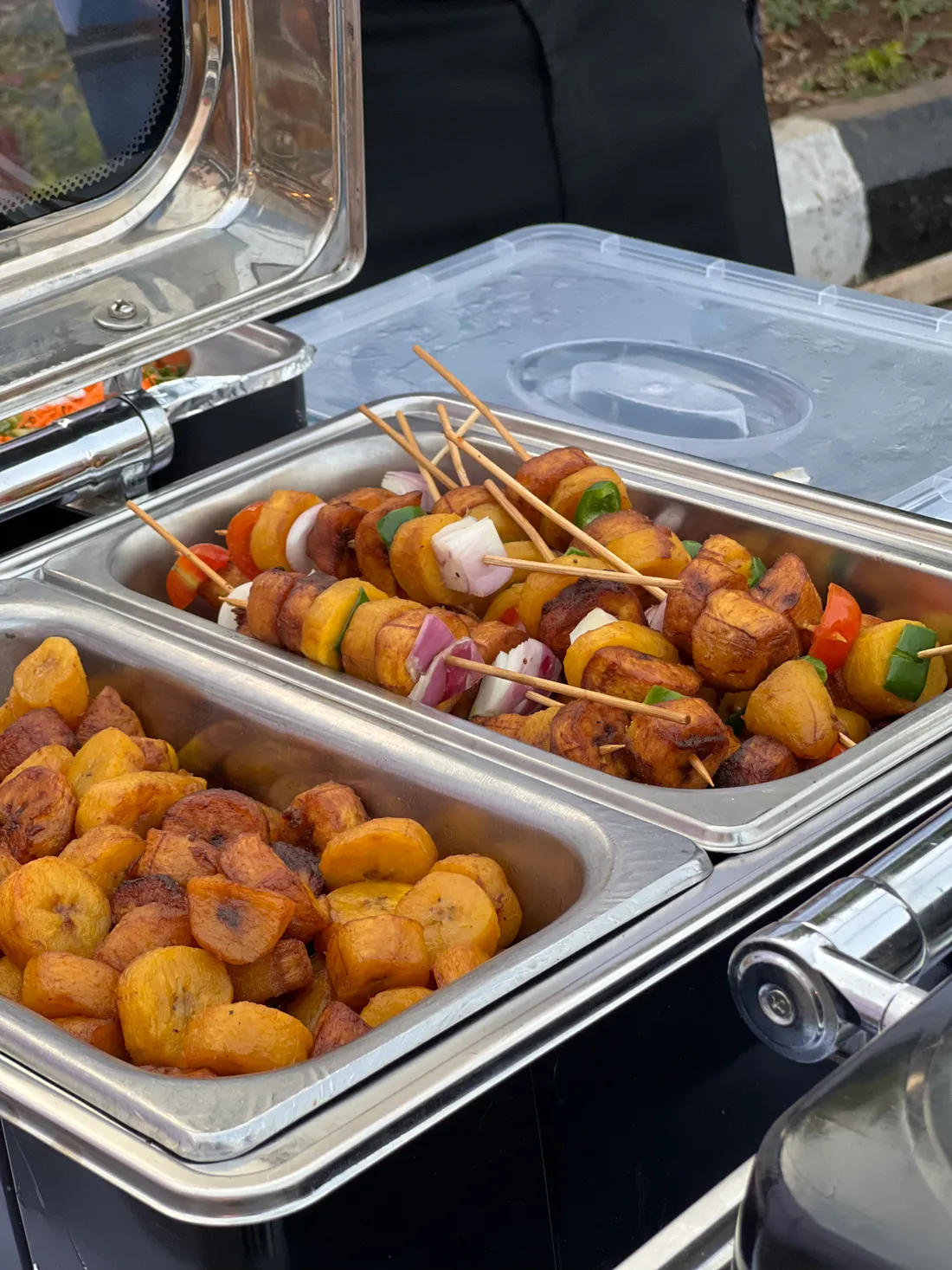 Party trays of plantain and skewers at an event