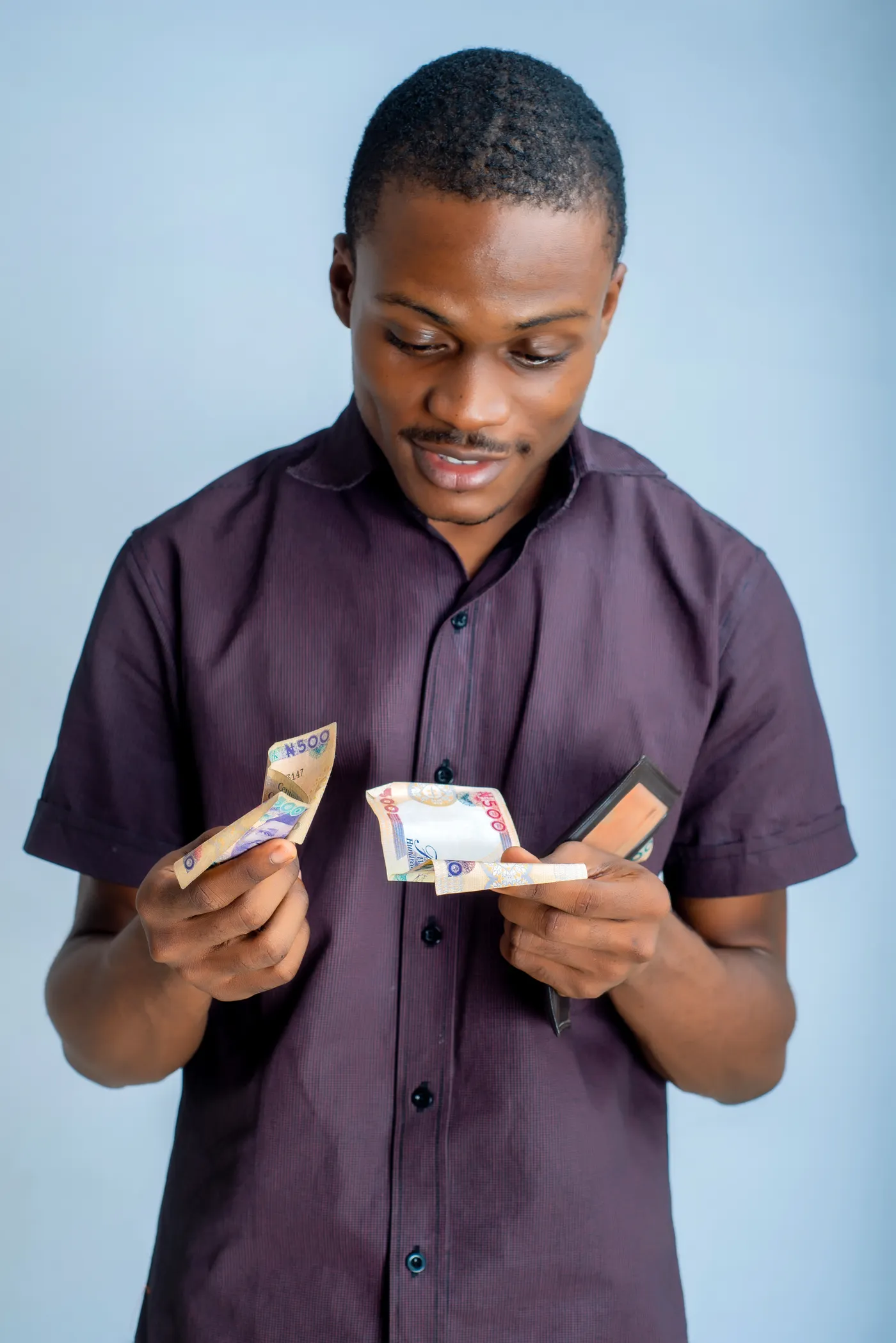 A man counting naira banknotes
